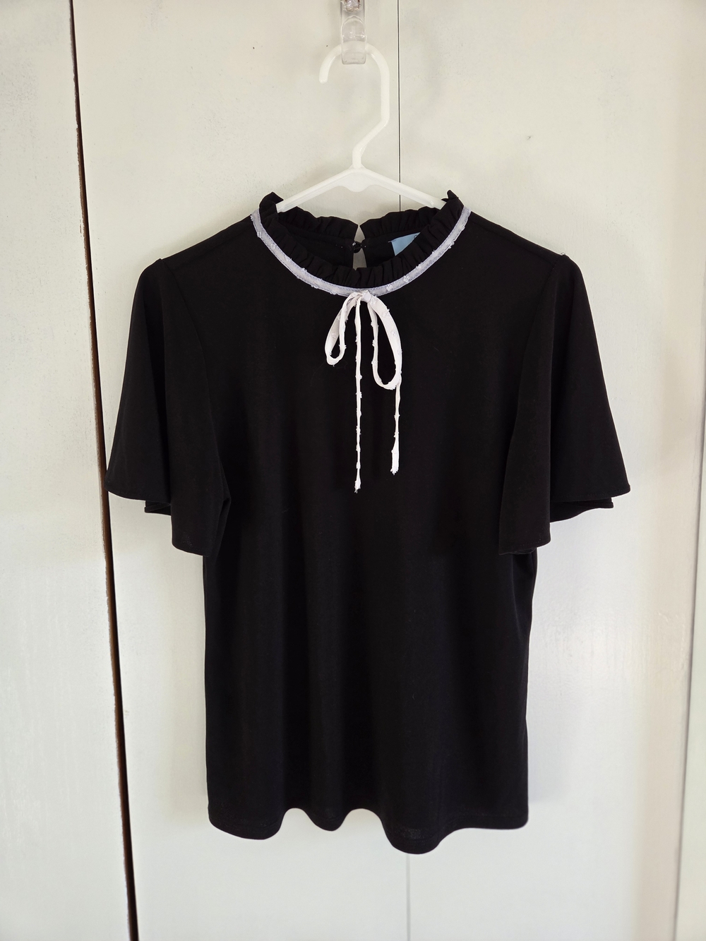 CeCe Black Short-Sleeve Ruffle Tie-Neck Top with Light Blue Trim